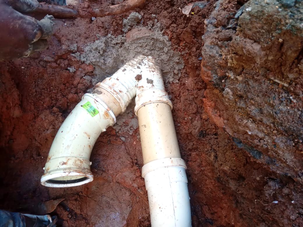 Sewer pipe Y-junction laid in an excavated trench